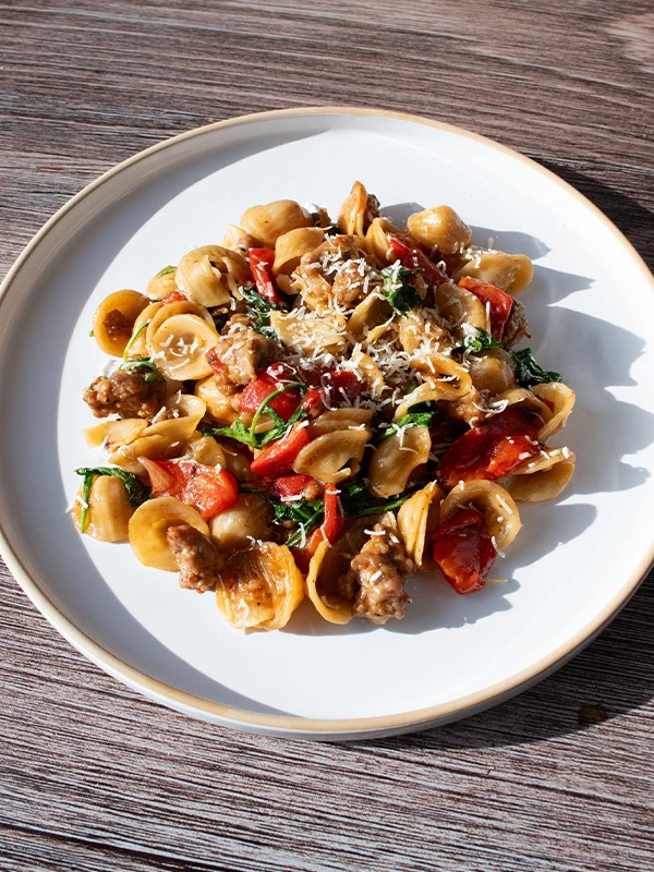 Orecchiette with Italian Sausage, Roasted Peppers & Arugula